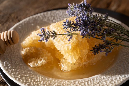 Plate showcasing Raw NH Wildflower Honeycomb with lavender garnish